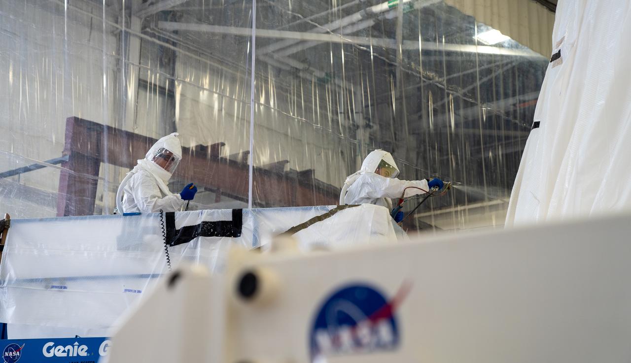 These photos show how technicians at NASA’s Marshall Space Flight Center in Huntsville, Alabama, have applied the thermal protection system material to the launch vehicle stage adapter (LVSA) of NASA’s SLS (Space Launch System) rocket for Artemis III, which will land astronauts on the Moon to advance long-term lunar exploration and scientific discovery and inspire the Artemis Generation. The LVSA is a cone-shaped element that connects the mega rocket’s core stage to its interim cryogenic propulsion stage (ICPS), partially enclosing it and protecting its avionics and electrical systems from the extreme pressures, sounds, and temperatures during launch and flight. Teams at Marshall began applying the thermal protection system material in the spring of 2023. Unlike other parts of the SLS rocket, the thermal protection system material for the LVSA is applied entirely by hand using a spray gun. During application, the technicians use a thin measuring rod to gauge the proper thickness. Once the thermal protection system has cured, certain areas are sanded down to meet parameters. The entire process takes several months.  The LVSA is fully manufactured at Marshall by NASA, lead contractor Teledyne Brown Engineering, and the Jacobs Space Group’s ESSCA contract. The LVSA for Artemis III is the last of its kind as future SLS rockets will transition to its next, more powerful Block 1B configuration beginning with Artemis IV. NASA is working to land the first woman and first person of color on the Moon under Artemis. SLS is part of NASA’s backbone for deep space exploration, along with the Orion spacecraft, advanced spacesuits and rovers, the Gateway in orbit around the Moon, and commercial human landing systems. SLS is the only rocket that can send Orion, astronauts, and supplies to the Moon in a single mission. 
